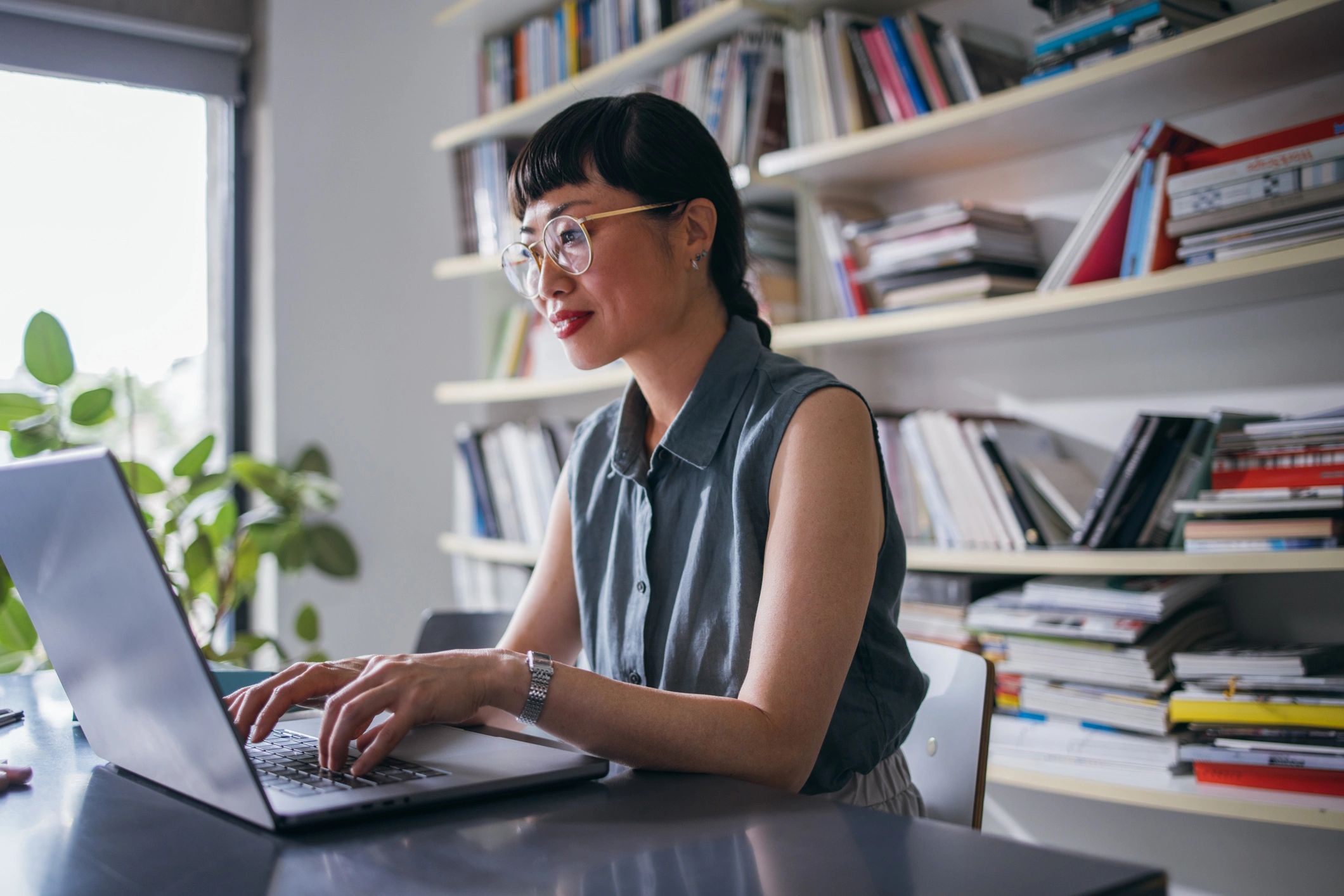 Professional working on a laptop at a desk